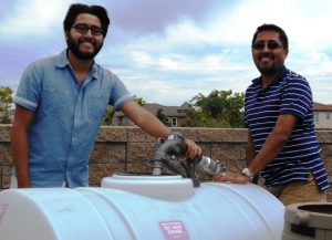 brothers using recycled water fill station