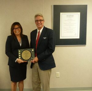 Finance Manager and Board President acccept budget award