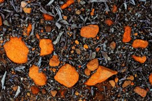 orange rocks in black mulch